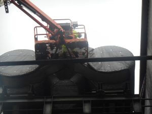 a Cordtape Energy engineer fitting custom insulation jackets to a vessel in a recycling plant