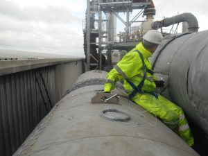 a Cordtape Energy engineer fitting bespoke insulation jacket to a vessel in a recycling plant